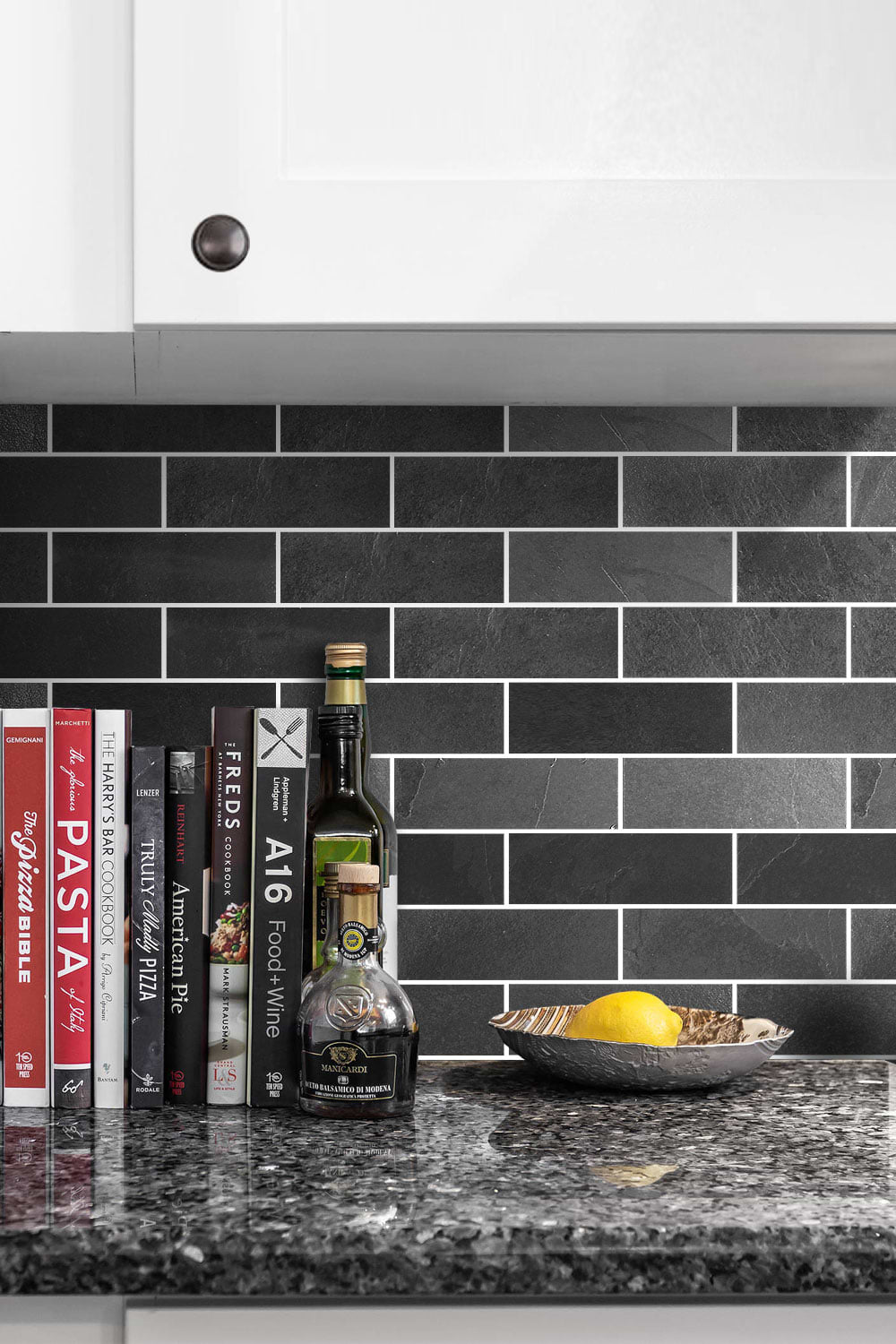 Black backsplash White color cabinet