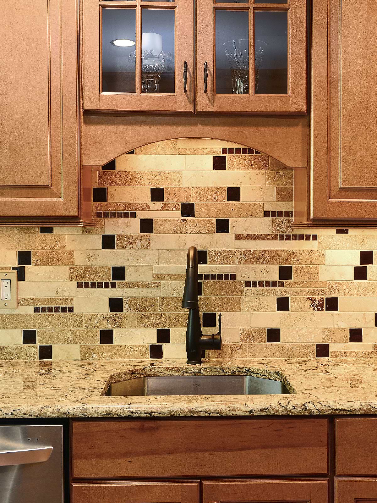 Brown cabinets quartz countertop travertine backsplash tile BA1025