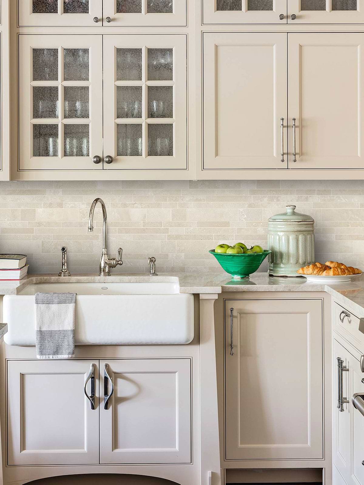 Rustic beige kitchen with travertine ivory backsplash tile