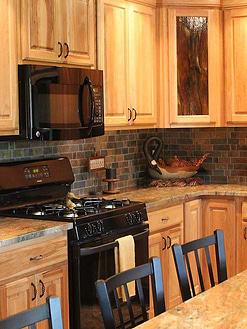 Oak kitchen cabinets rustic brown gray mosaic tile madura gold granite countertop BA1063