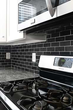 gray granite countertop white cabinet black slate mosaic tile BA1070