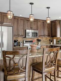 Brown cabinet granite countertop travertine backsplash tile