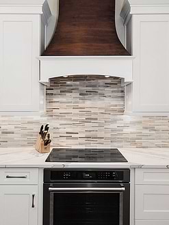 Modern white cabinet sink quartz countertop bronze hood subway marble backsplash tile BA1034