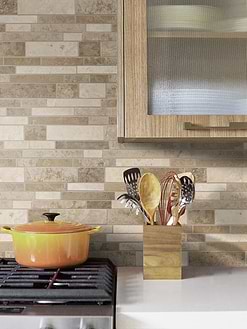 white quartz countertop with travertine brown backsplash tile