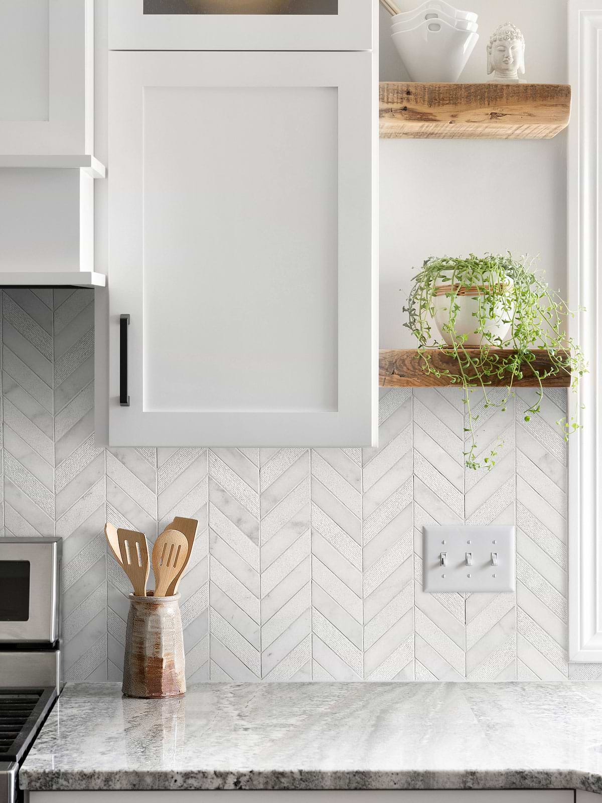 gray granite countertop with cabinets and white marble chevron backsplash tile BA631613