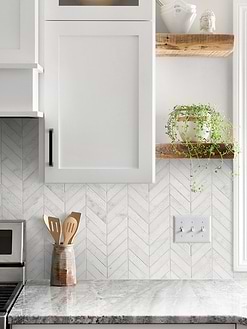gray granite countertop with cabinets and white marble chevron backsplash tile BA631613