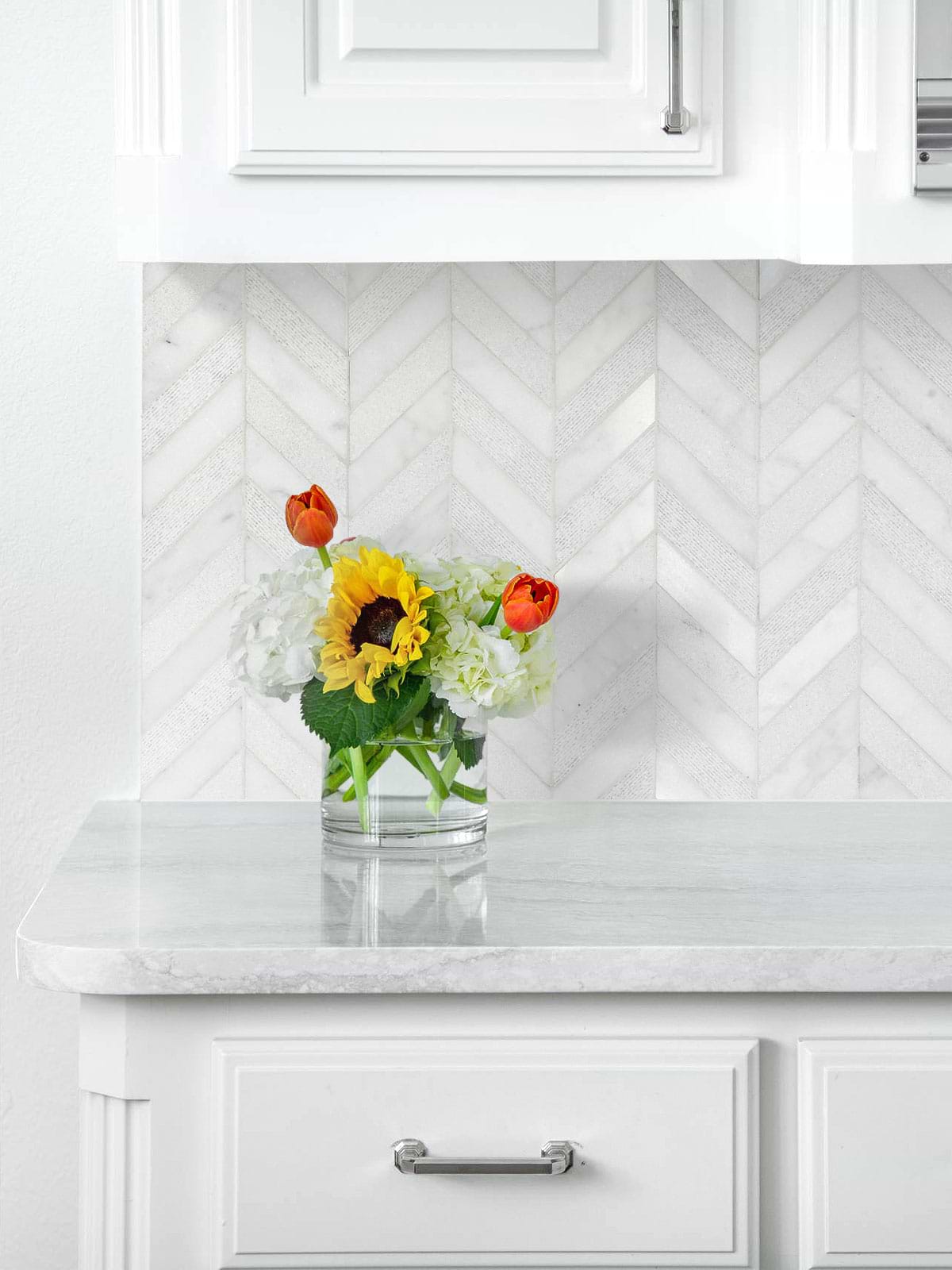white marble countertop cabinets with white chevron backsplash tile BA631613