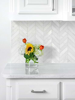 white marble countertop cabinets with white chevron backsplash tile BA631613