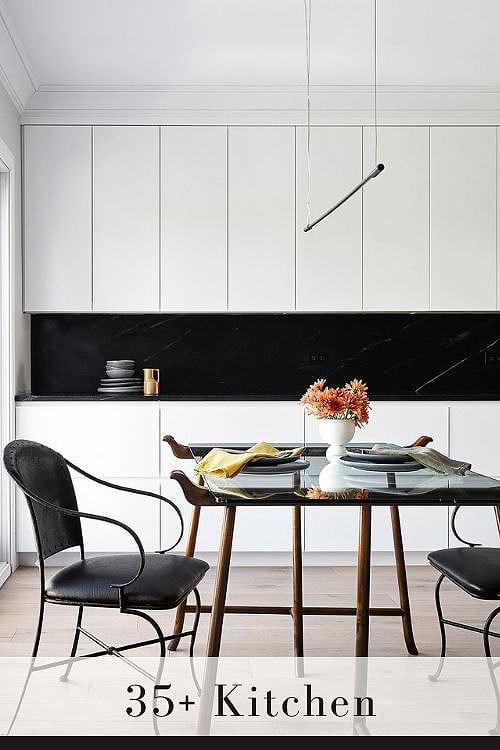 White Cabinets with Black Backsplash