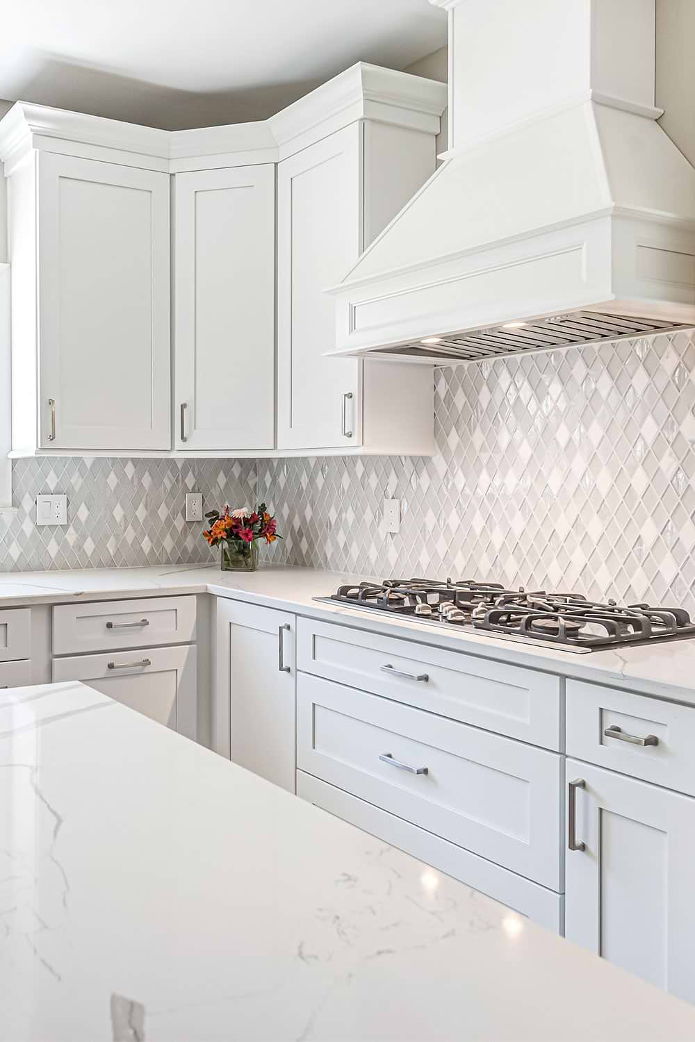 white quartz countertop white cabinet backsplash