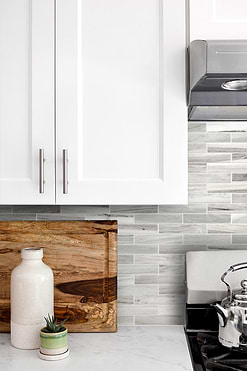white kitchen quartz countertop marble backsplash tile