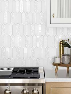 white glass mosaic backsplash tile with light oak kitchen cabinet
