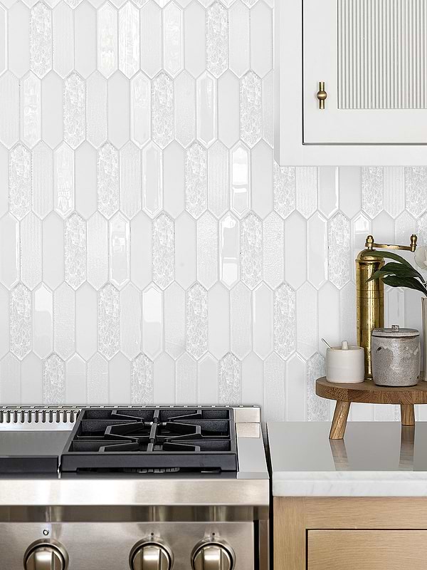 white glass mosaic backsplash tile with light oak kitchen cabinet