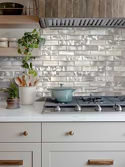 Gray Cabinet with Space Brown Subway Glass Backsplash Tile