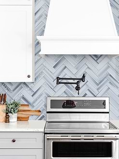 Light Gray Cabinet with Blue Gray Herringbone Glass Tile BA5507