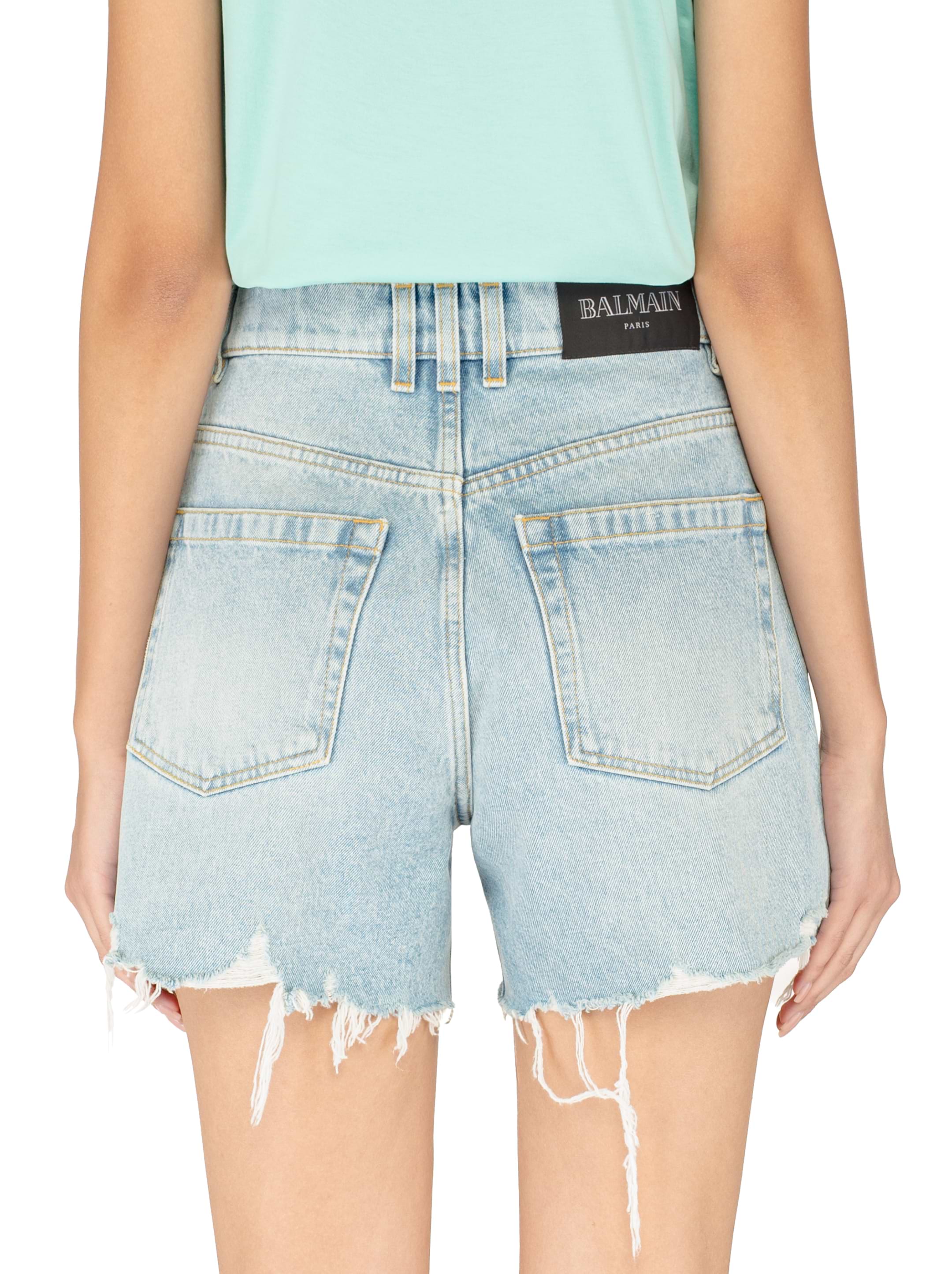 Denim shorts with a torn effect Balmain for women - buy in