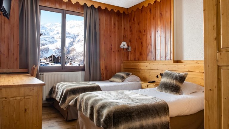 One of the twin rooms