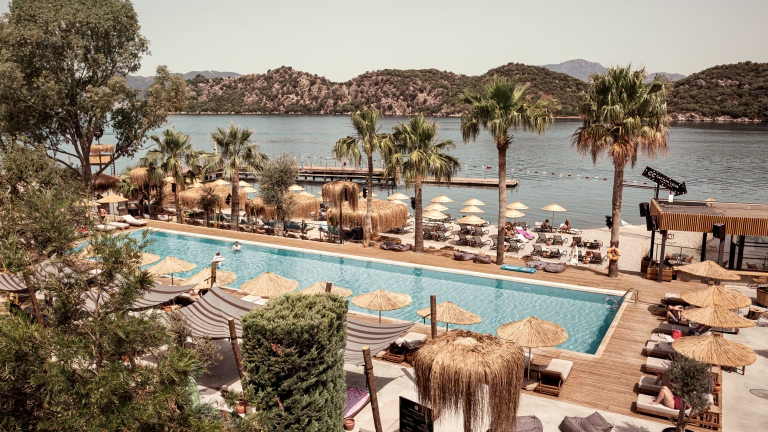 Swimming pool and beach front at Neilson | Cook's Club Adakoy