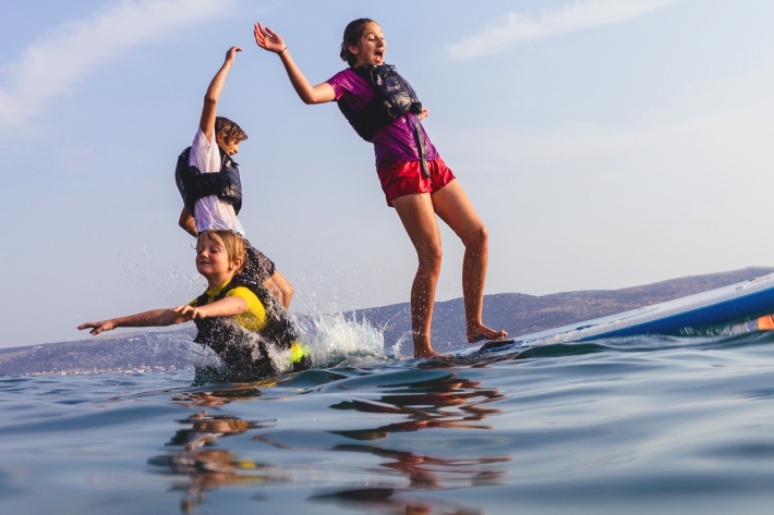 kids on paddle board