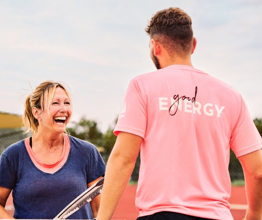 Neilson tennis coach with guest