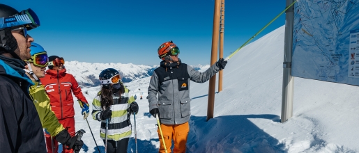 Neilson mountain expert showing guiding group around the mountain