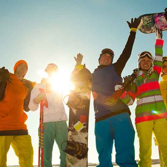 group of young skiers and snowboarders