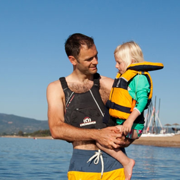 Man and young girl in sea