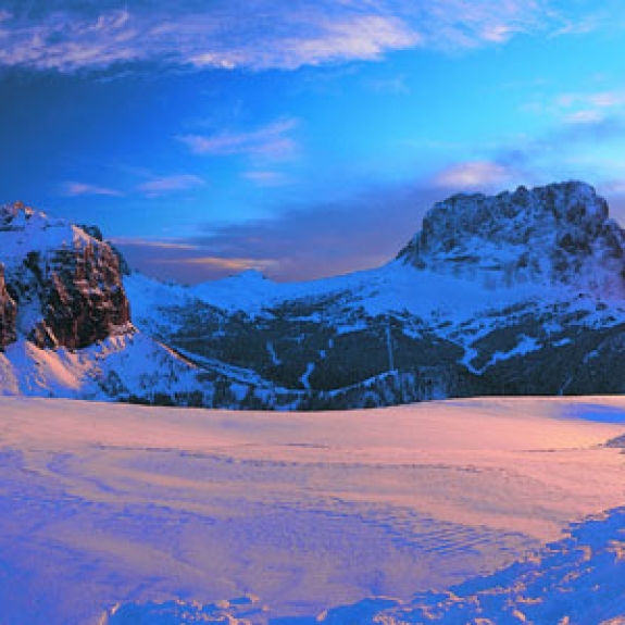 sun rise over Italian mountains covered in snow