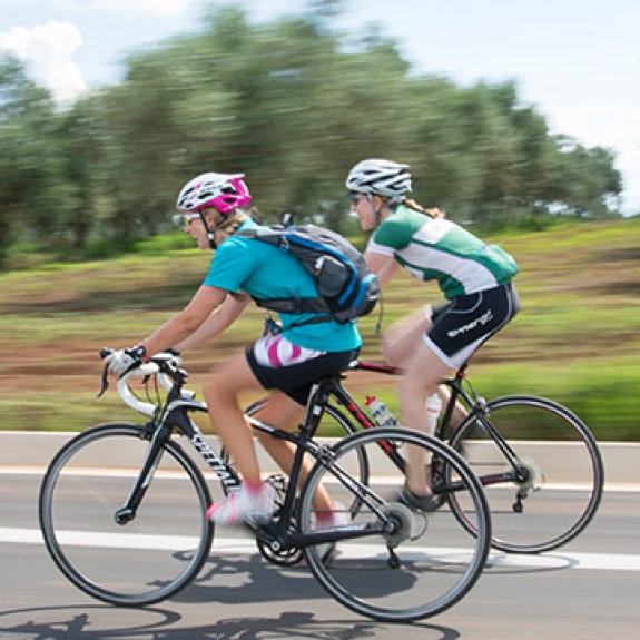 Group of people road biking