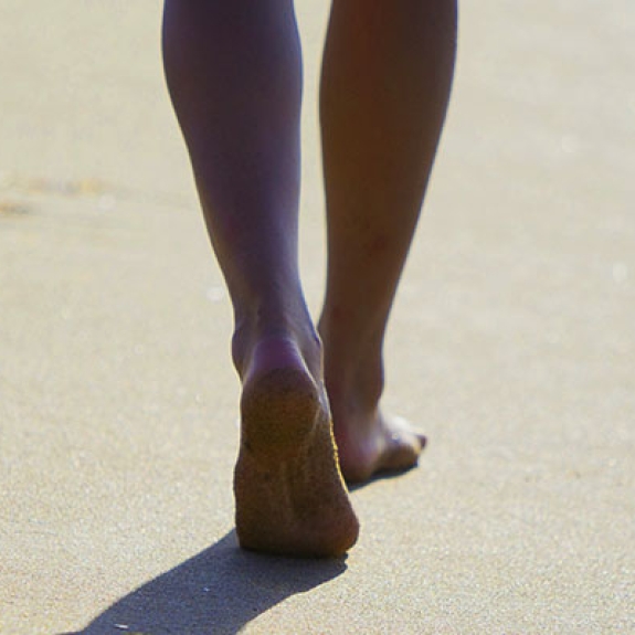 woman walking along the beach