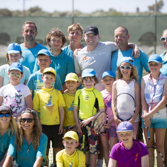 Group of children on tennis court