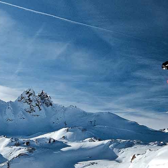 skier jumping from a Cliff drop