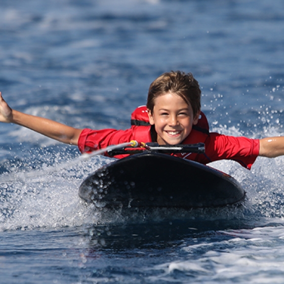 Young boy on kneeboard