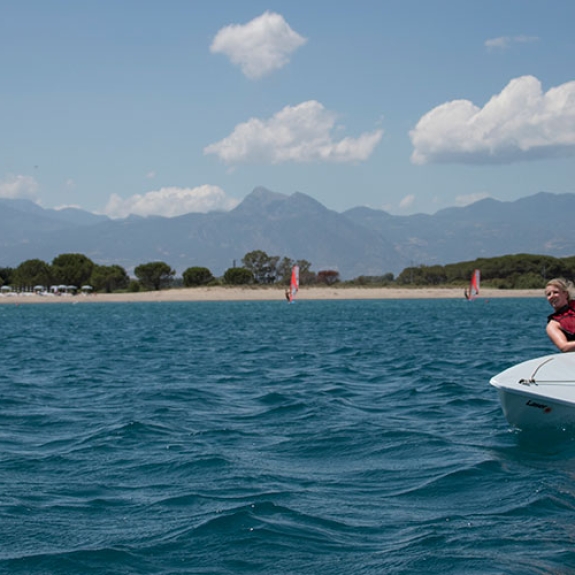 Woman sailing a dinghy