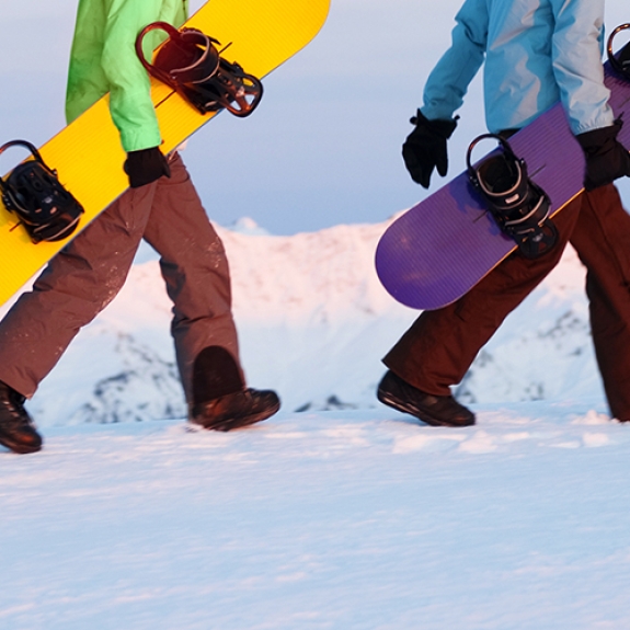 snowboarders walking with their boards