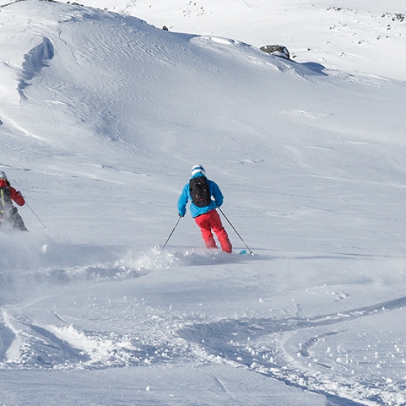 Group of people skiing in powder