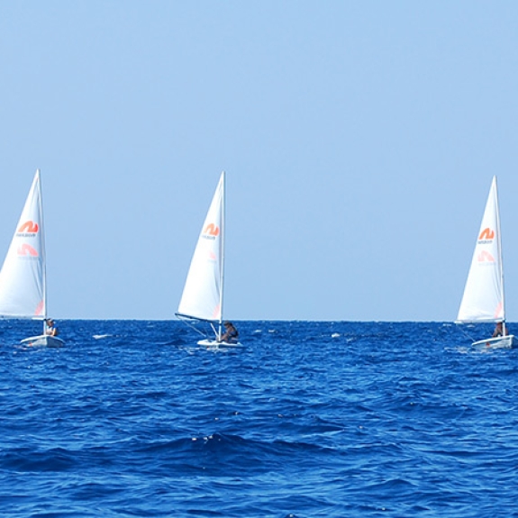 Group of people sailing dinghies