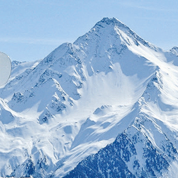man standing holding a snowboard