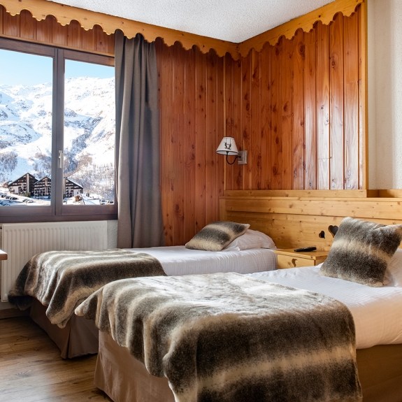 One of the twin rooms