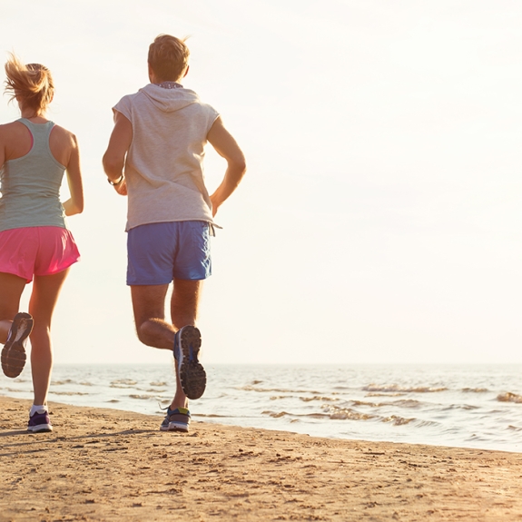 couple running on a beach