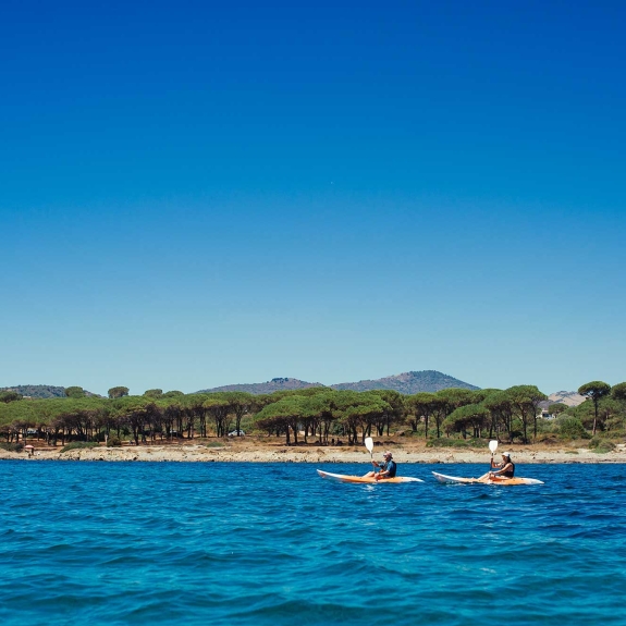 Two people kayaking in Sardinia