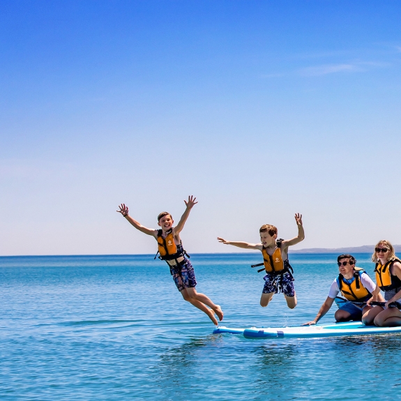 family paddle boarding