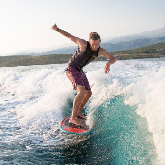 man wakesurfing