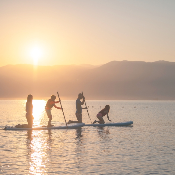 Family on paddle boards in Greece