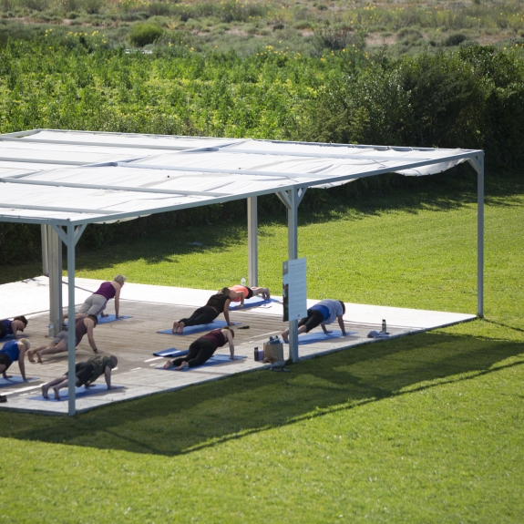 Fitness platform in the gardens at Buca Beach Club