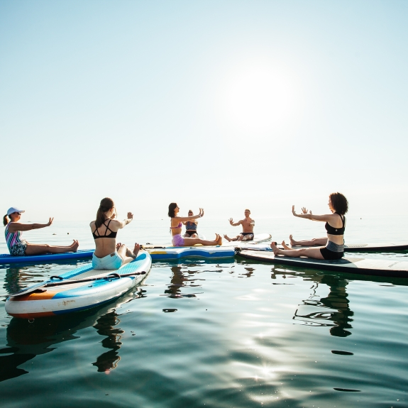 Sunrise and sunset SUP yoga at Neilson | Cook's Club Adakoy