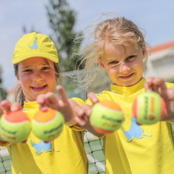 Girls holding tennis balls