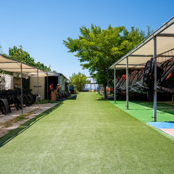 Windsurf and bike racks at Cosmos Beach Club