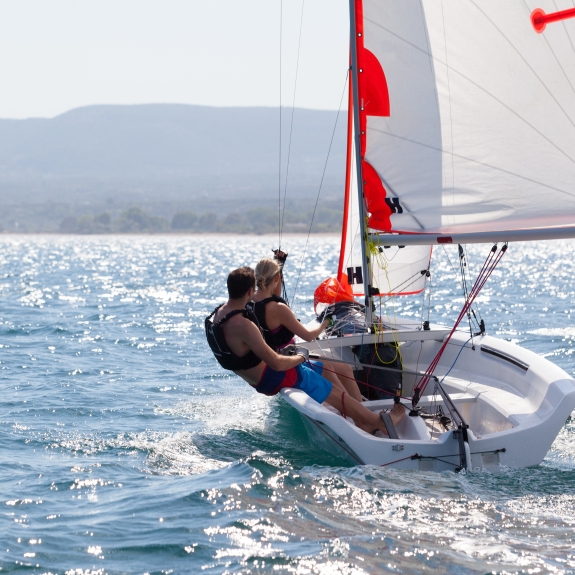 Couple enjoying the sailing at Messini Beach Club