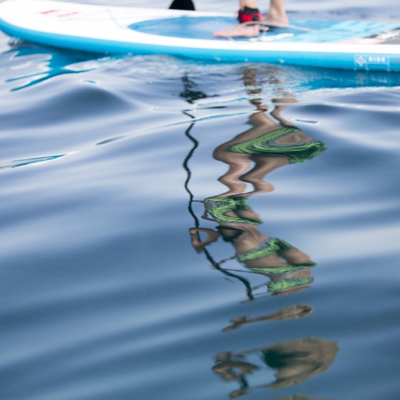 Blue seas, paddle boarding